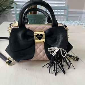 Betsey Johnson handbag. 8 inches long, 6 inches high. Shoulder strap included